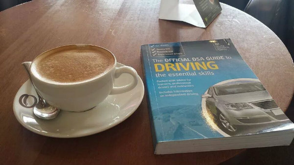 Driving guide beside cappuccino