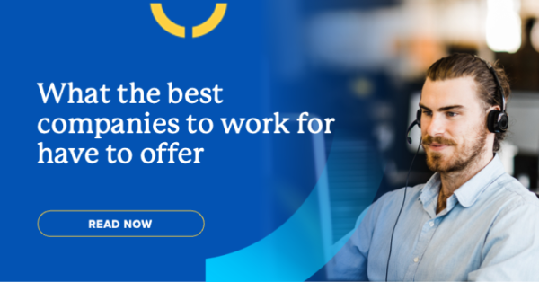 Photo of Keypath employee sitting at computer with headset on