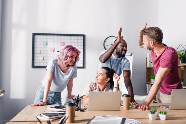 In a workplace, a team discuss key performance indicators for employees.