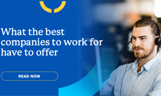 Photo of Keypath employee sitting at computer with headset on