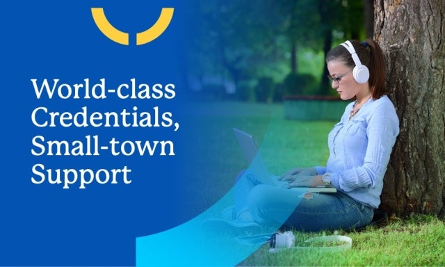 A young woman sits outside with her laptop studying one of the best online college degrees